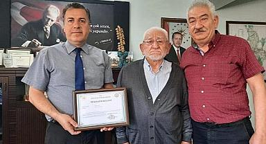 KAYMAKAM'DAN YILLARIN ESNAFI BURHAN ŞAHİN’E TEŞEKKÜR BELGESİ