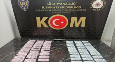 Kütahya'da ormana mantar aramaya giden kişi, toprağa gömülü sahte paralar buldu