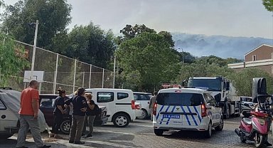 İzmir'in Dikili ilçesinde makilik alanda çıkan yangın kontrol altına alındı